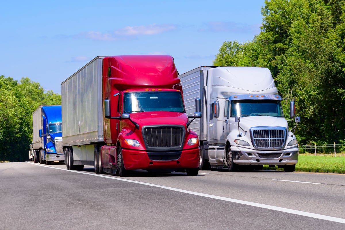 Modern trucking fleet on interstate highway